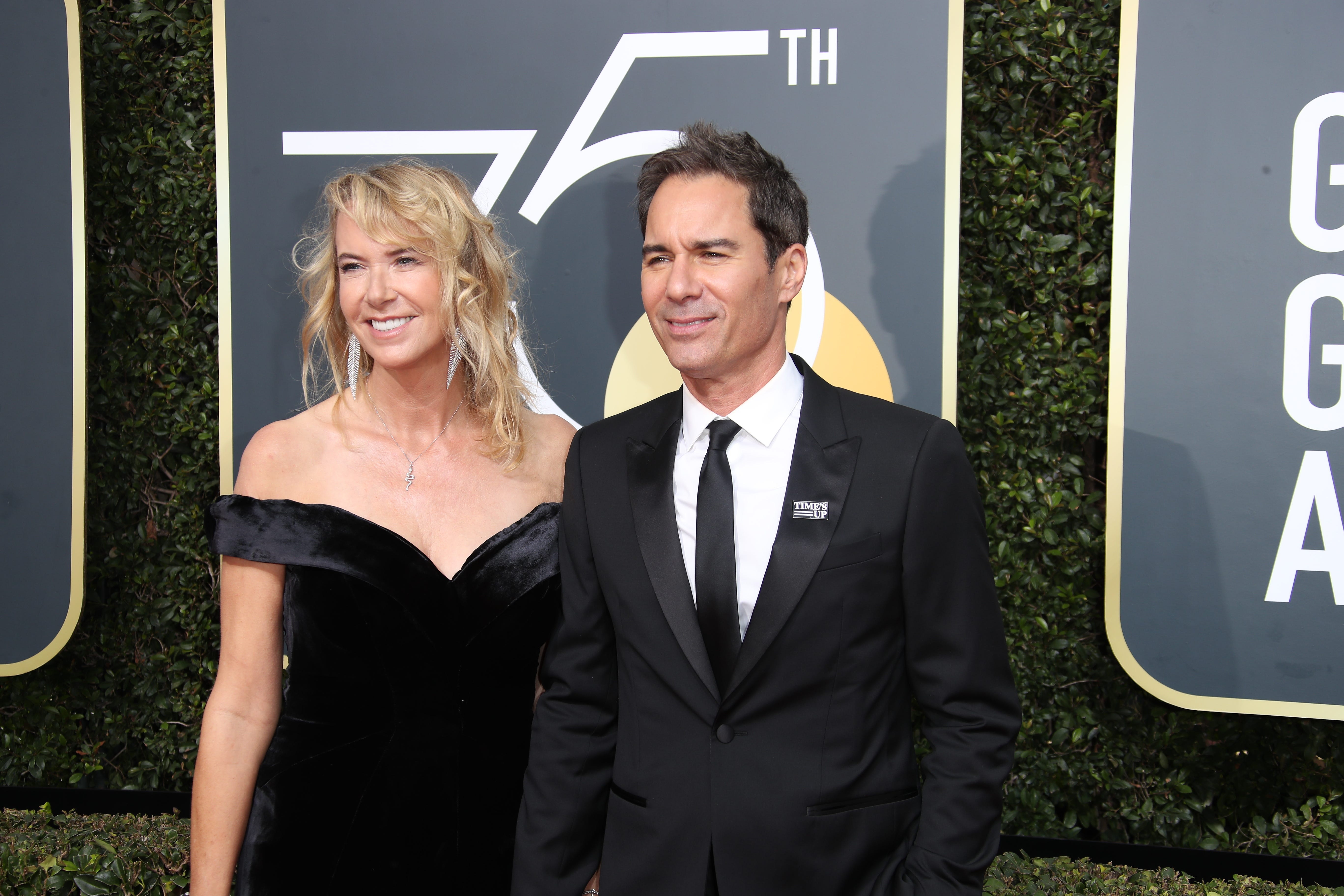 Jan 7, 2018; Beverly Hills, CA, USA; Janet Holden, left, and Eric McCormack arrive for the 75th Golden Globe Awards at the Beverly Hilton. Mandatory Credit: Dan MacMedan-USA TODAY NETWORK (Via OlyDrop)