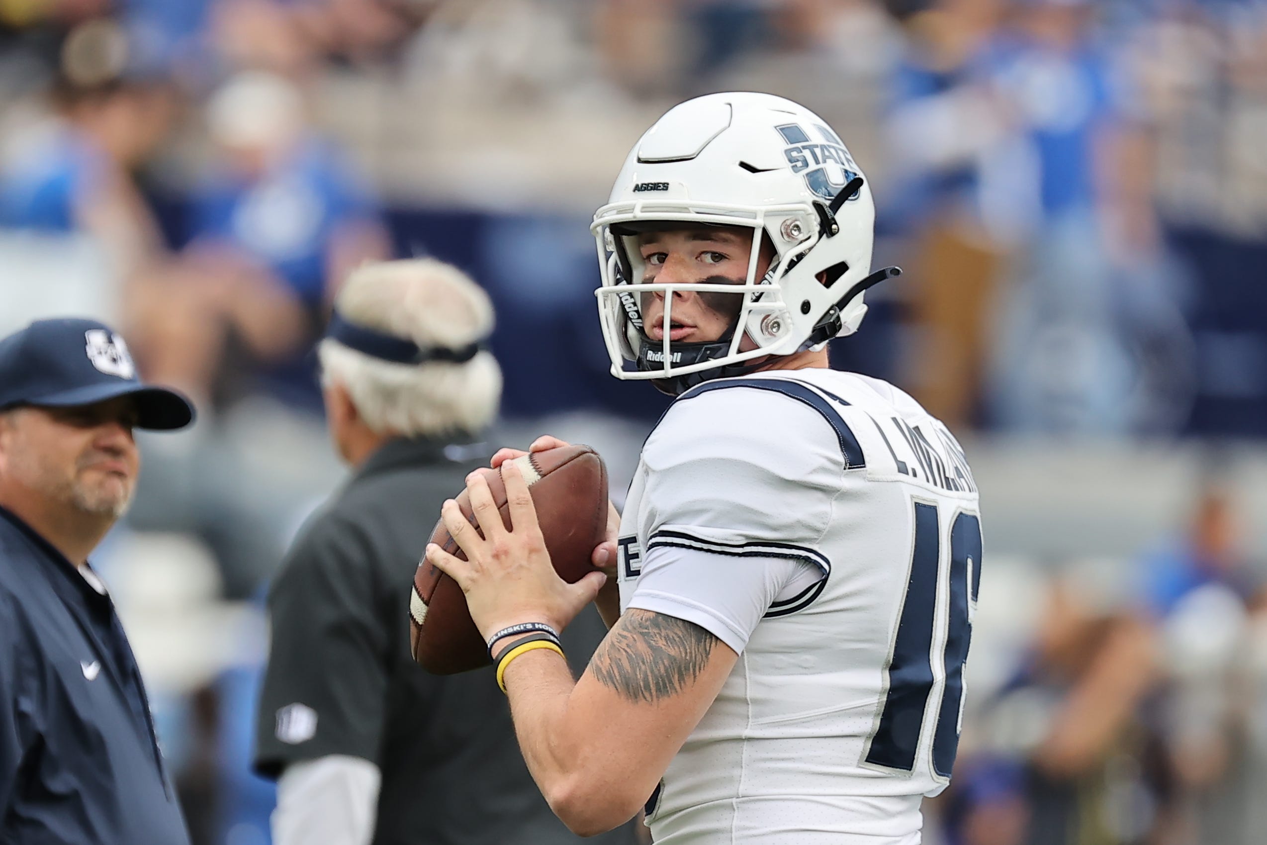 Utah State Aggies quarterback Levi Williams (16) warms up prior to a game against the Brigham Young Cougars at LaVell Edwards Stadium.