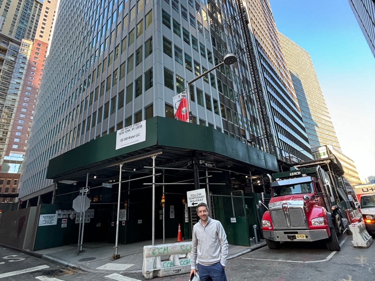Joey Chilelli, managing director of Vanbarton Group, LLC, stands outside 160 Water Street in Manhattan, which is being converted from an office tower to a residential building
