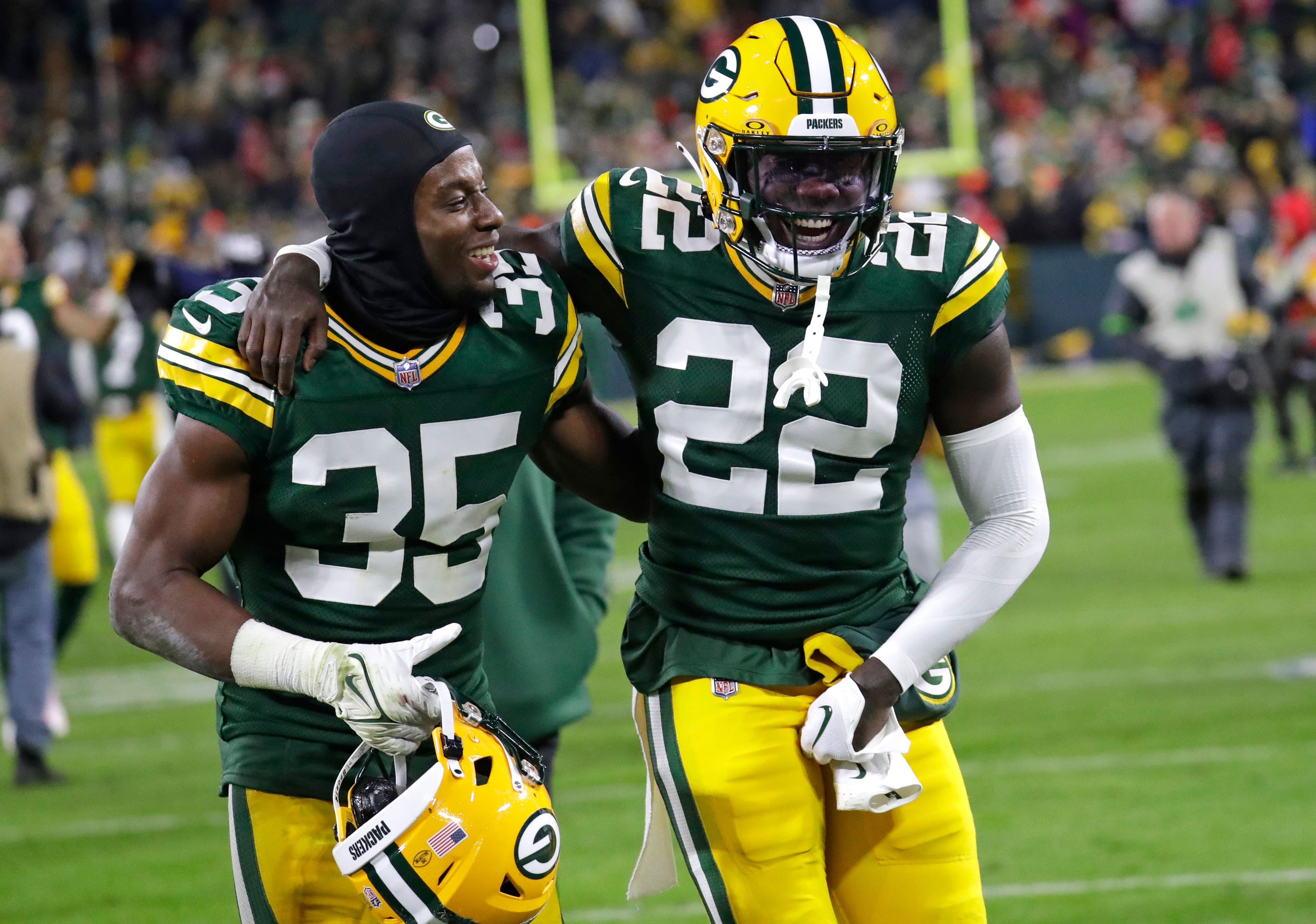 Green Bay Packers cornerback Corey Ballentine (35) and cornerback Robert Rochell (22) celebrate after defeating the Kansas City Chiefs at Lambeau Field.