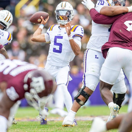 LSU quarterback Jayden Daniels looks to throw during his team's game against Texas A&M in Tiger Stadium in Baton Rouge, Louisiana, November 25, 2023.
