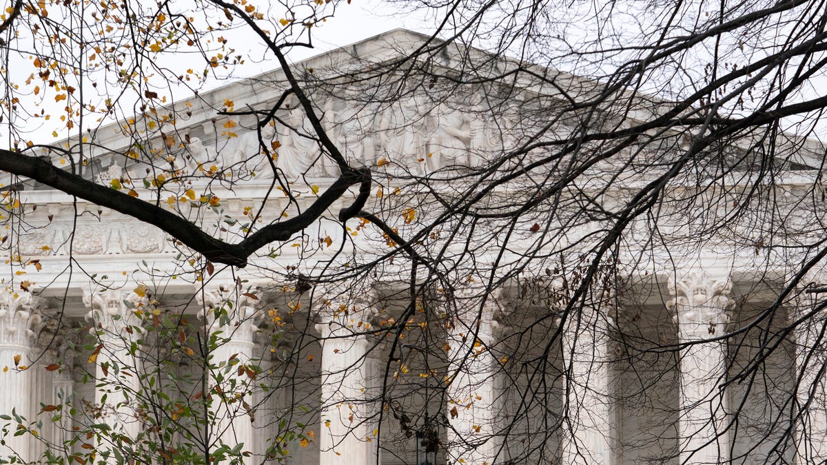 The Supreme Court is seen amid bare tree branches, on Capitol Hill in Washington, Thursday, Dec. 7, 2023.