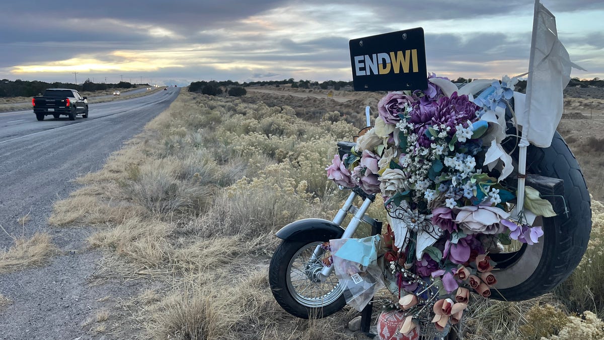 A memorial along New Mexico Highway 264 honors Janella Bryant, a motorcyclist who was killed by a drunken driver in September 2020.