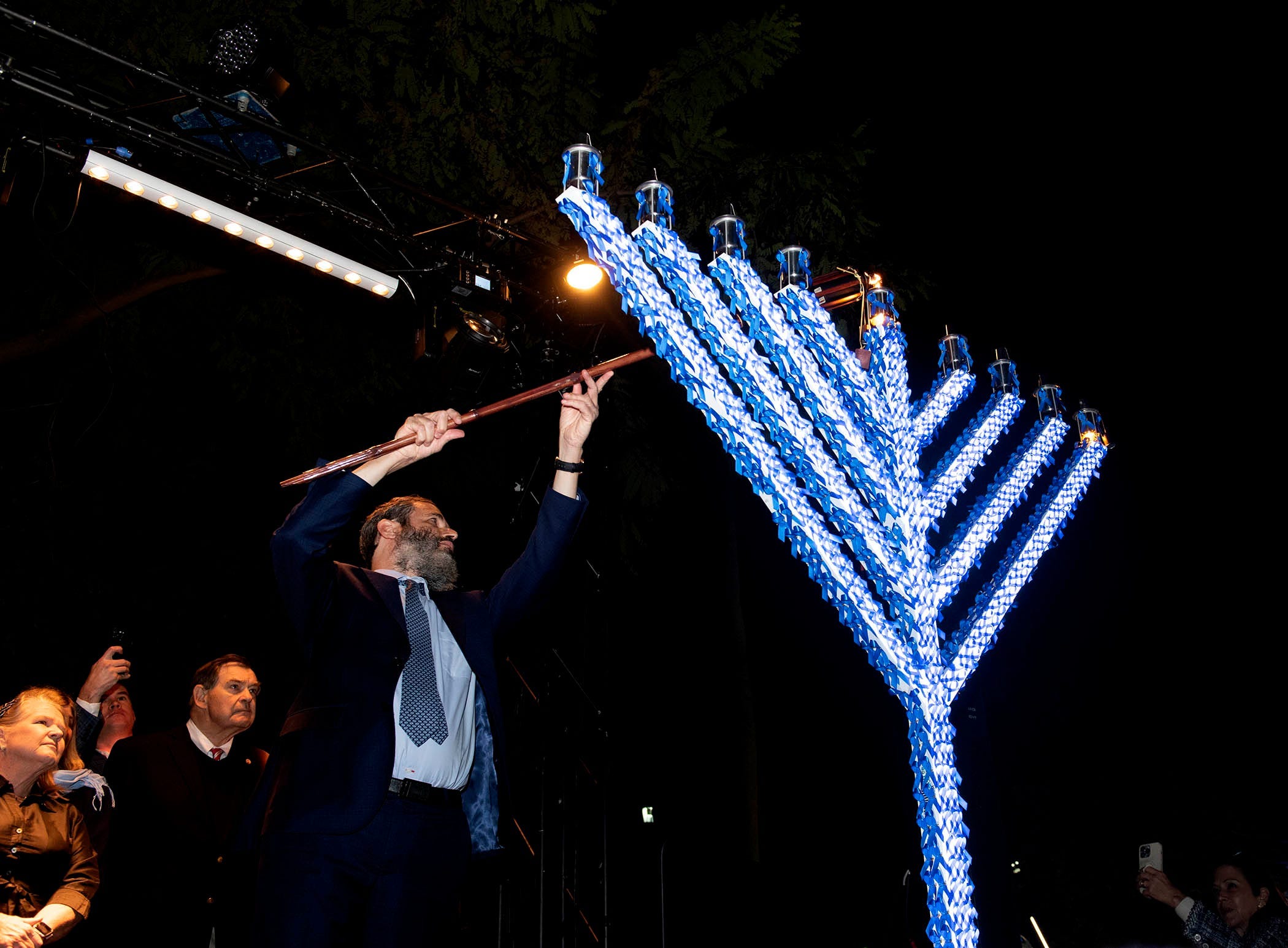 Rabbi Moshe Scheiner of Palm Beach Synagogue lights the menorah on the first night of Hanukkah during the annual Hanukkah event at Bradley Park December 8, 2023 in Palm Beach.