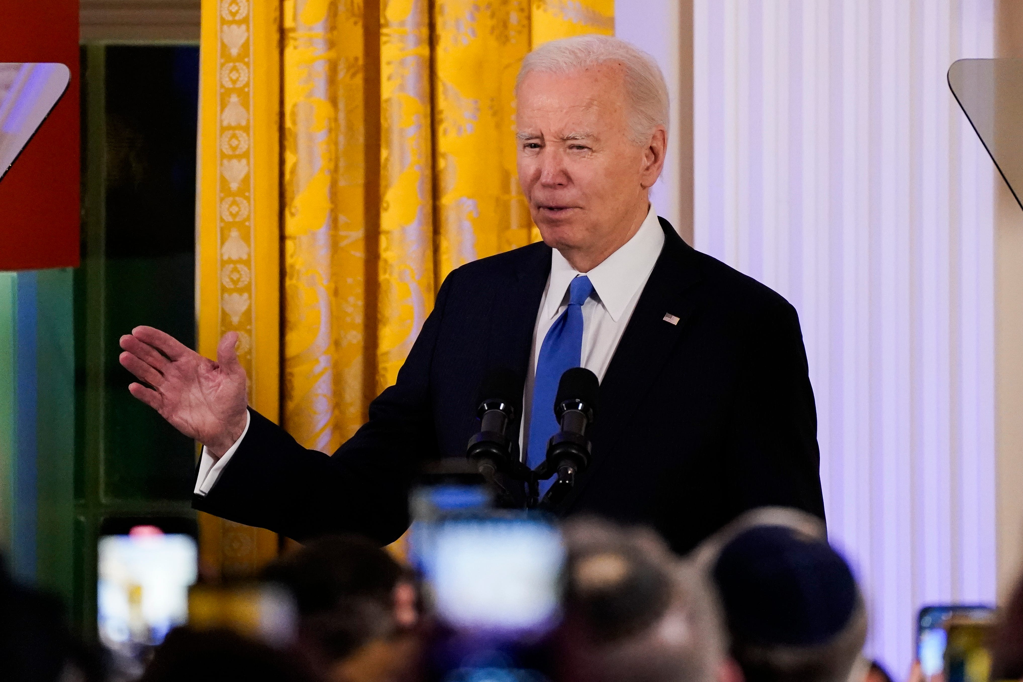 President Joe Biden speaks at a Hanukkah reception in the East Room of the White House on December 11, 2023 in Washington, DC. President Biden and first lady Jill Biden host a reception to mark the Jewish holidays.