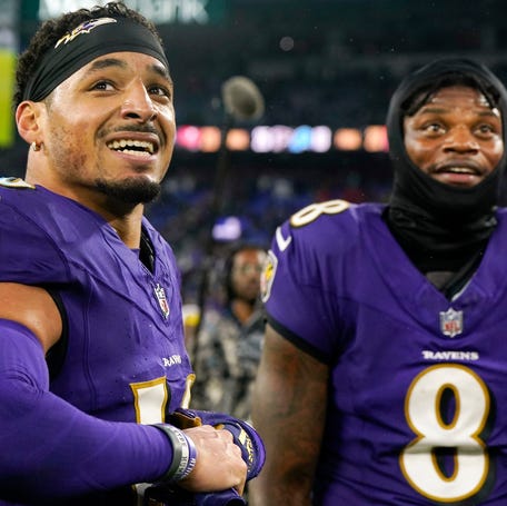 Baltimore Ravens wide receiver Tylan Wallace (16) and quarterback Lamar Jackson (8) celebrate after winning in overtime against the Los Angeles Rams at M&T Bank Stadium.