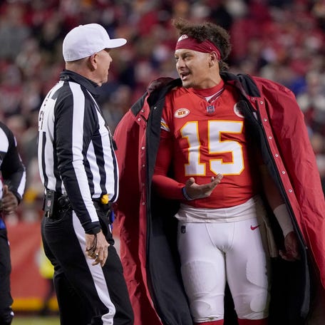 Kansas City Chiefs quarterback Patrick Mahomes (15) talks with an official during the second half of an NFL football game against the Buffalo Bills Sunday, Dec. 10, 2023, in Kansas City, Mo.