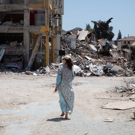 UNFPA Global Goodwill Ambassador Ashley Judd walks through streets in Antakya, Hatay, where the damage and destruction from the earthquakes in February 2023 is still visible.