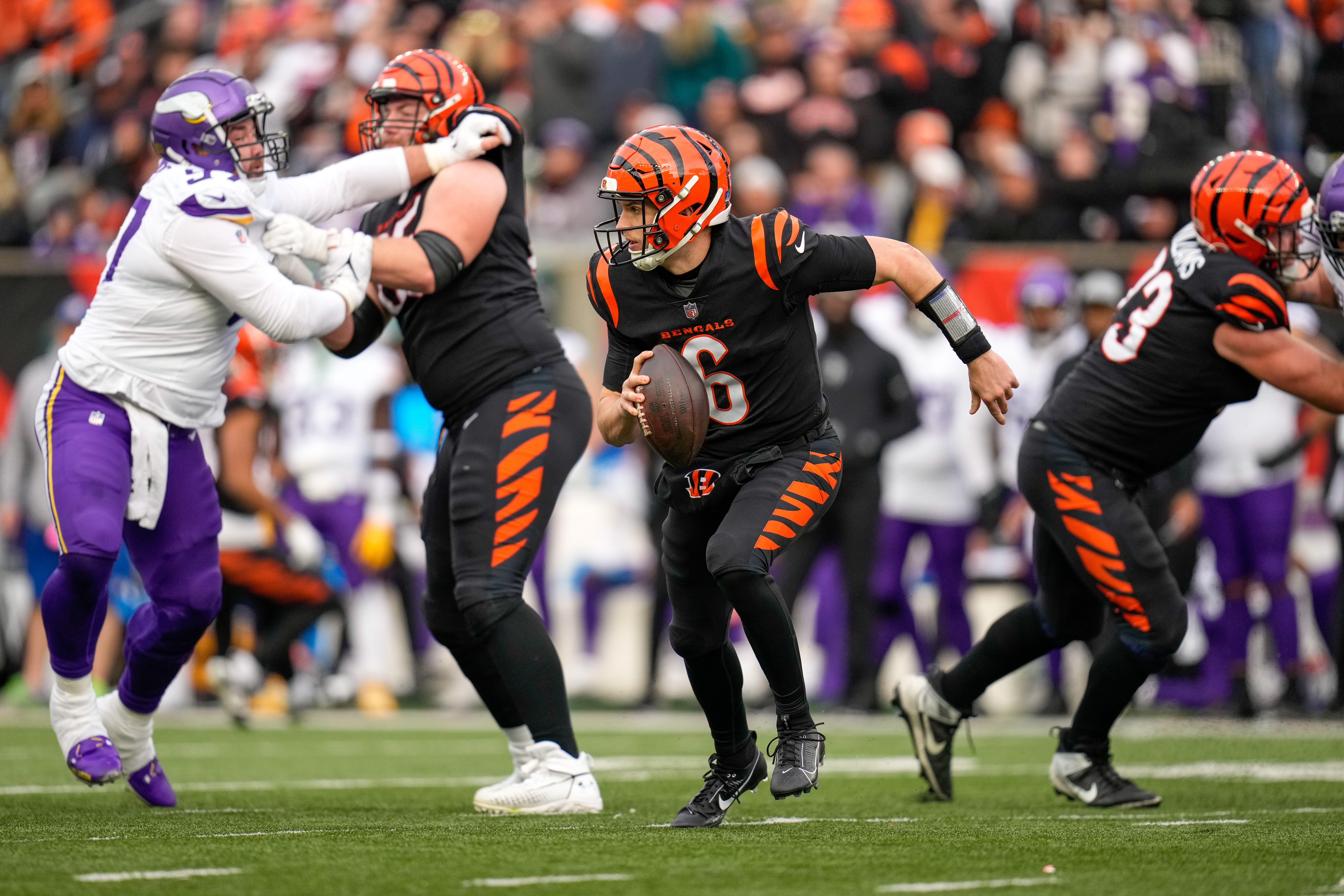 Cincinnati Bengals quarterback Jake Browning (6) scrambles in the second quarter of the NFL Week 15 game between the Cincinnati Bengals and the Minnesota Vikings at PayCor Stadium in downtown Cincinnati on Saturday, Dec. 16, 2023.