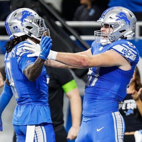 Detroit Lions tight end Sam LaPorta celebrates a touchdown against Denver Broncos with wide receiver Jameson Williams during the first half at Ford Field in Detroit on Saturday, Dec. 16, 2023.