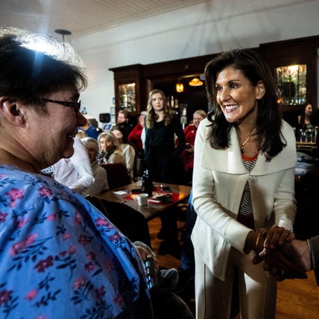 Republican presidential candidate Nikki Haley shakes hands with a supporter during a campaign stop at K & B Emporium on Saturday, Dec. 9, 2023, in Clear Lake, Ia.