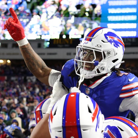 James Cook #4 of the Buffalo Bills celebrates with teammates after scoring a touchdown in the second quarter against the New York Jets at Highmark Stadium on November 19, 2023 in Orchard Park, New York.