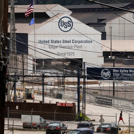 A person walks by part of the U.S. Steel Edgar Thomson Works in Braddock, Pa., that will be part $1 billion upgrade U.S. Steel plans for it's three Mon Valley Works, Thursday, May 2, 2019. The Mon Valley Works include Edgar Thomson Works, the Clairton Coke Work, in Clairton, Pa., and the Irvin Plant in West Mifflin, Pa.