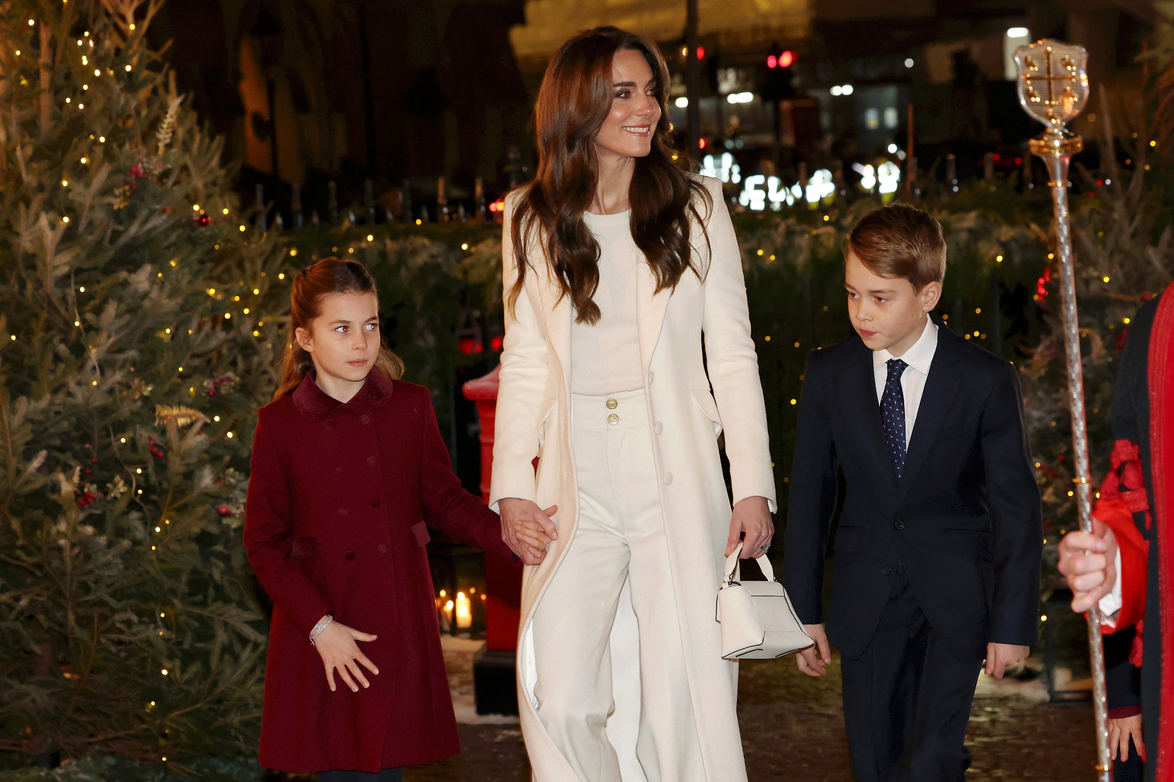 Britain's Catherine, Princess of Wales (C), Britain's Princess Charlotte of Wales (L) and Britain's Prince George of Wales (R) arrive to attend the "Together At Christmas" Carol Service" at Westminster Abbey in London on December 8, 2023. The event will be broadcast as part of 'Royal Carols: Together At Christmas', a special programme, airing at 7:45pm on ITV1 and ITV X on Christmas Eve. (Photo by Chris Jackson / POOL / AFP) (Photo by CHRIS   JACKSON/POOL/AFP via Getty Images) ORIG FILE ID: 1833529978