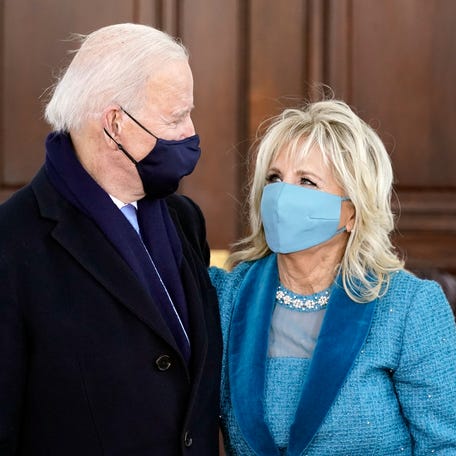 President Joe Biden and first lady Jill Biden hug as they arrive at the North Portico of the White House, Wednesday, Jan. 20, 2021, in Washington. (AP Photo/Alex Brandon, Pool)