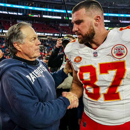 Dec 17, 2023; Foxborough, Massachusetts, USA; New England Patriots head coach Bill Belichick and Kansas City Chiefs tight end Travis Kelce (87) on the field after the game at Gillette Stadium.