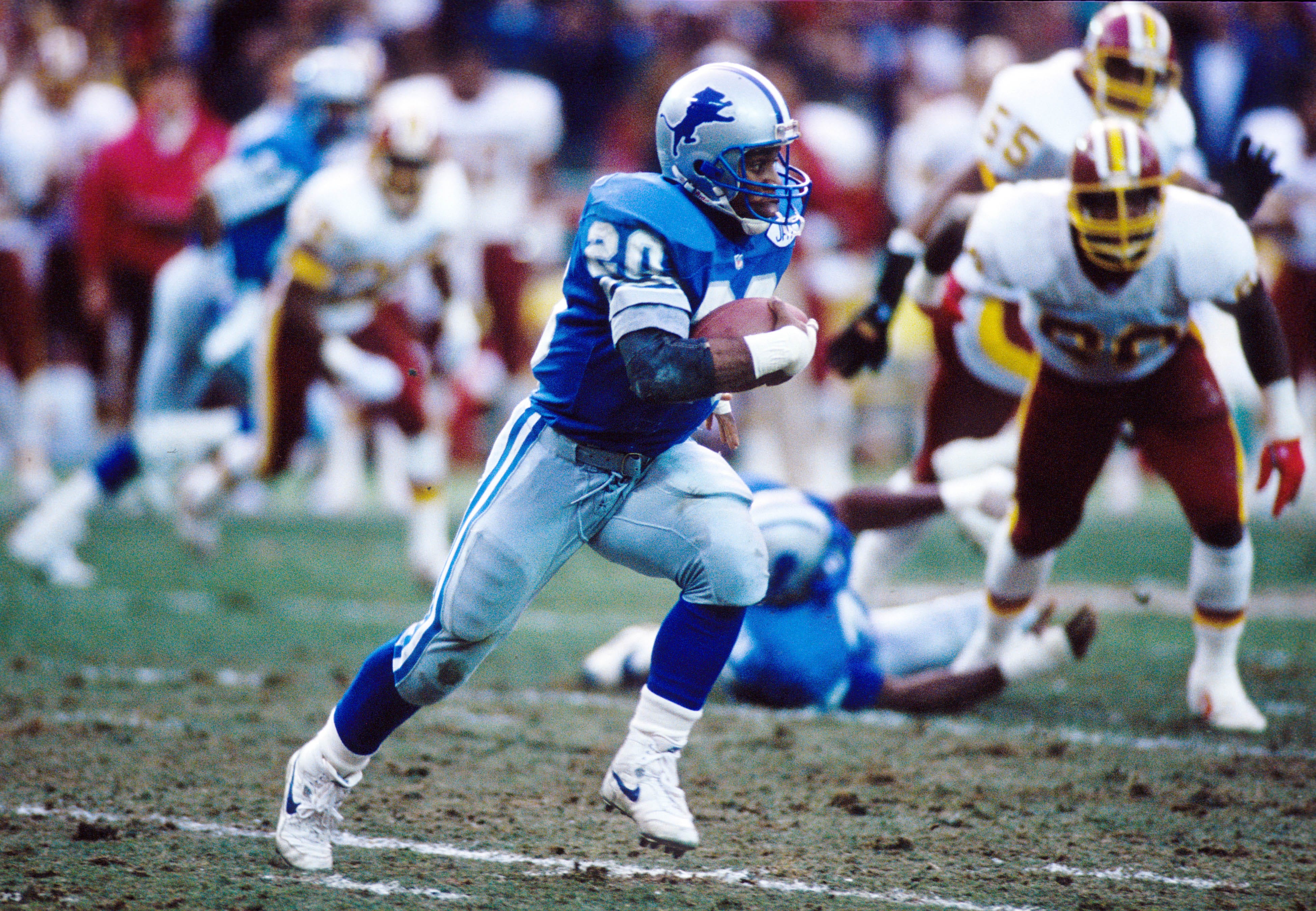 Detroit Lions running back Barry Sanders (20) carries the ball against Washington in the 1991 NFC Championship at RFK Stadium. The 1991 NFL season was the last time the Lions won a playoff game, the longest current drought in the NFL.
