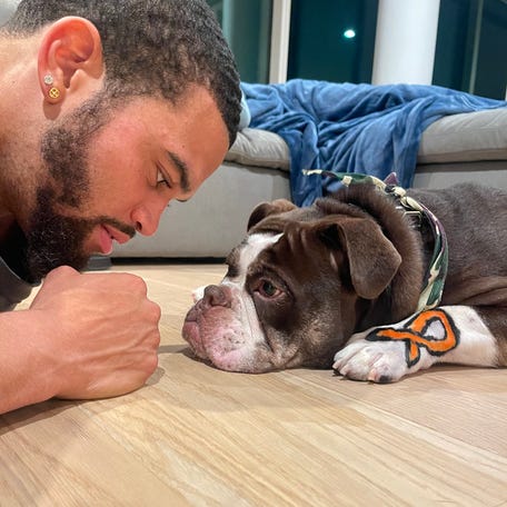 USC quarterback Caleb Williams and his dog Supa.