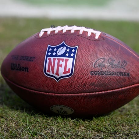 A detailed view of the NFL logo on a football prior to the game between the Minnesota Vikings and the Chicago Bears at Soldier Field on October 15, 2023 in Chicago, Illinois.