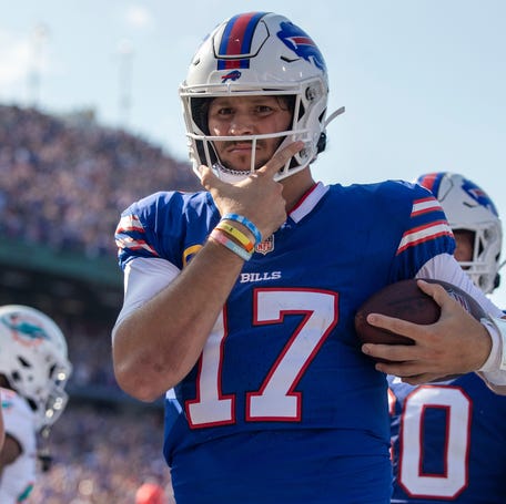 Buffalo Bills quarterback Josh Allen (17) celebrates after rushing for an 11-yard touchdown during an NFL football game, Sunday, Oct. 1, 2023, in Orchard Park, NY.
