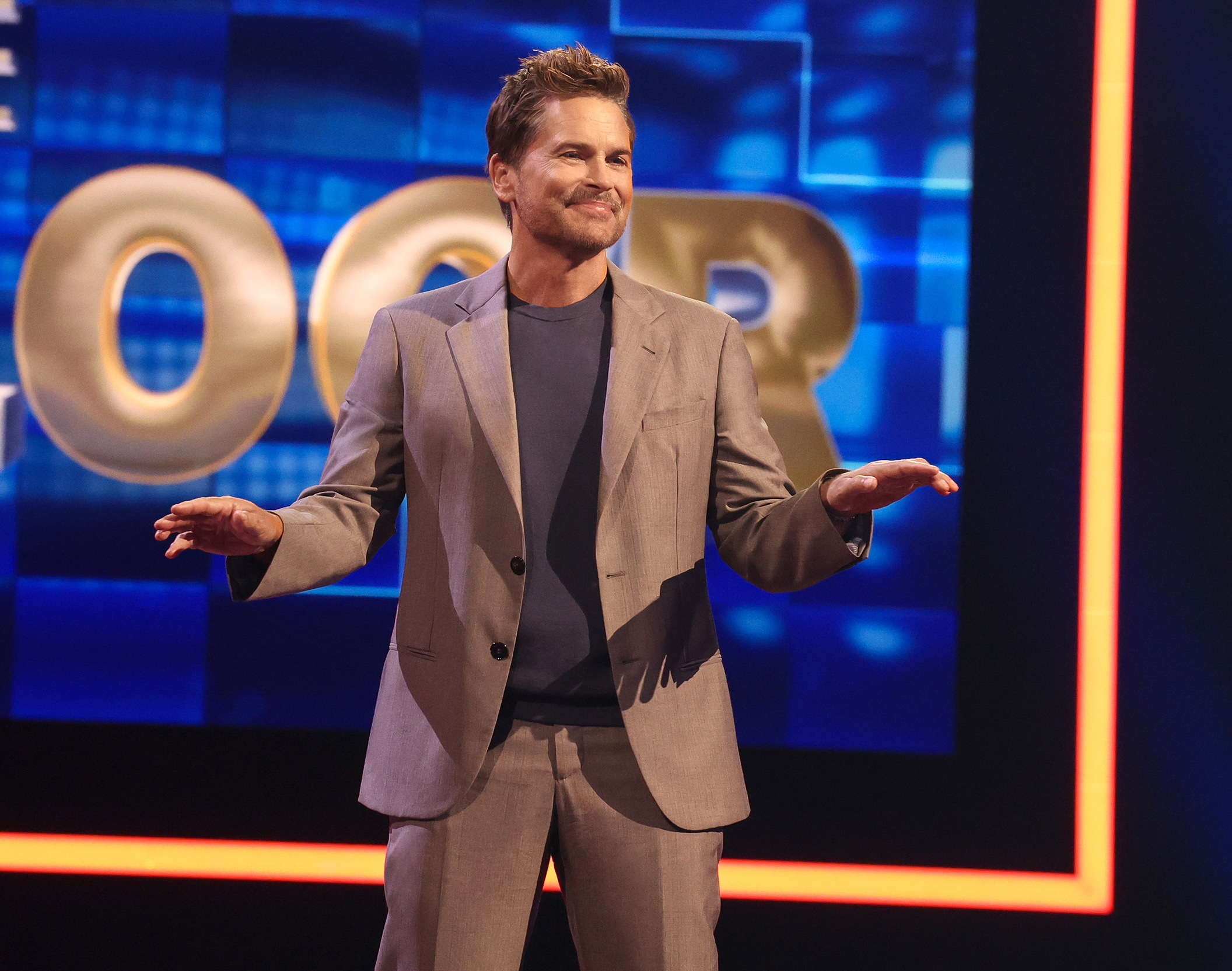 Rob Lowe brings the best, and busiest, hair in Hollywood to hosting Fox's "The Floor" gameshow.