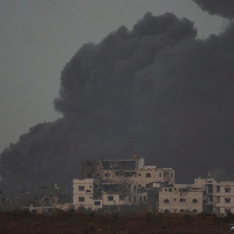 Smoke rises to the sky after an explosion in the Gaza Strip as seen from Southern Israel, Saturday, Dec. 23, 2023.