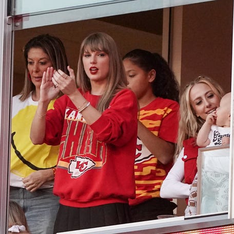 Recording artist Taylor Swift watches play against the Los Angeles Chargers during the game at GEHA Field at Arrowhead Stadium.