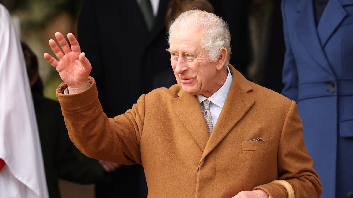 Britain's King Charles III waves to well-wishers.