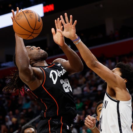 The Detroit Pistons' Isaiah Stewart (28) is fouled by the Brooklyn Nets' Spencer Dinwiddie.