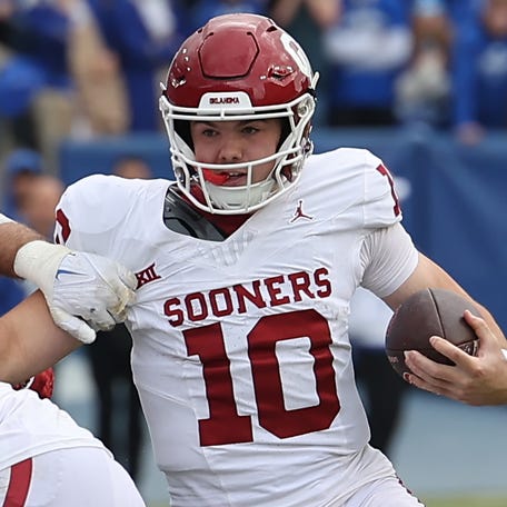 Oklahoma quarterback Jackson Arnold (10) runs the ball against Brigham Young during the fourth quarter of their game at LaVell Edwards Stadium.