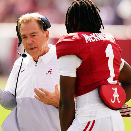 Alabama coach Nick Saban talks with defensive back Kool-Aid McKinstry (1) during the first quarter of the team's game against Arkansas at Bryant-Denny Stadium.