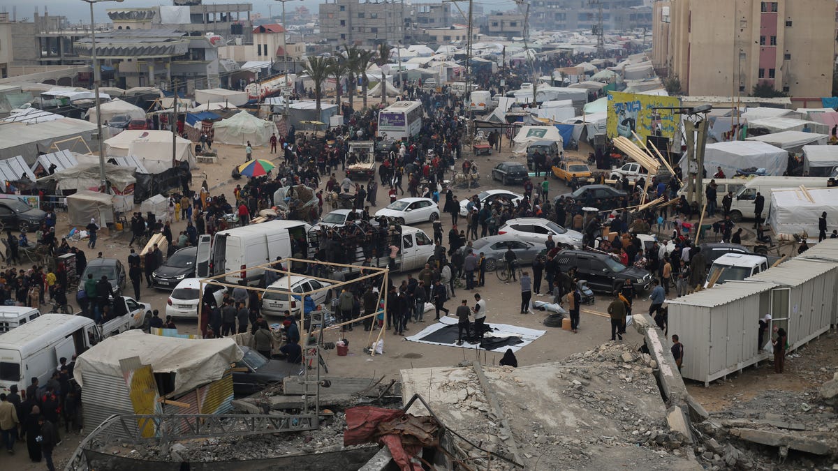 Displaced Palestinians arrive at a makeshift tent camp in Rafah, Gaza Strip, on Thursday, Dec. 28, 2023.