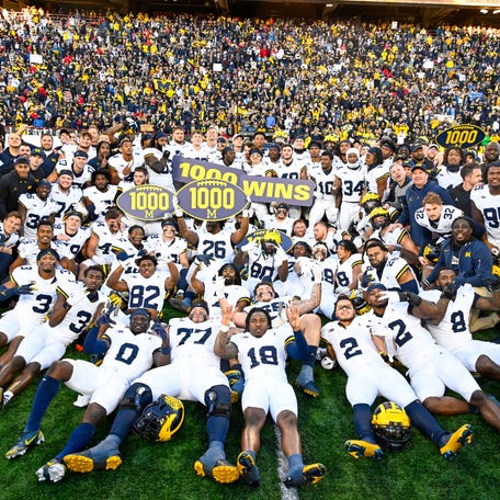 The Michigan Wolverines celebrate the program's 1,000th win, which came against the Maryland Terrapins in November.
