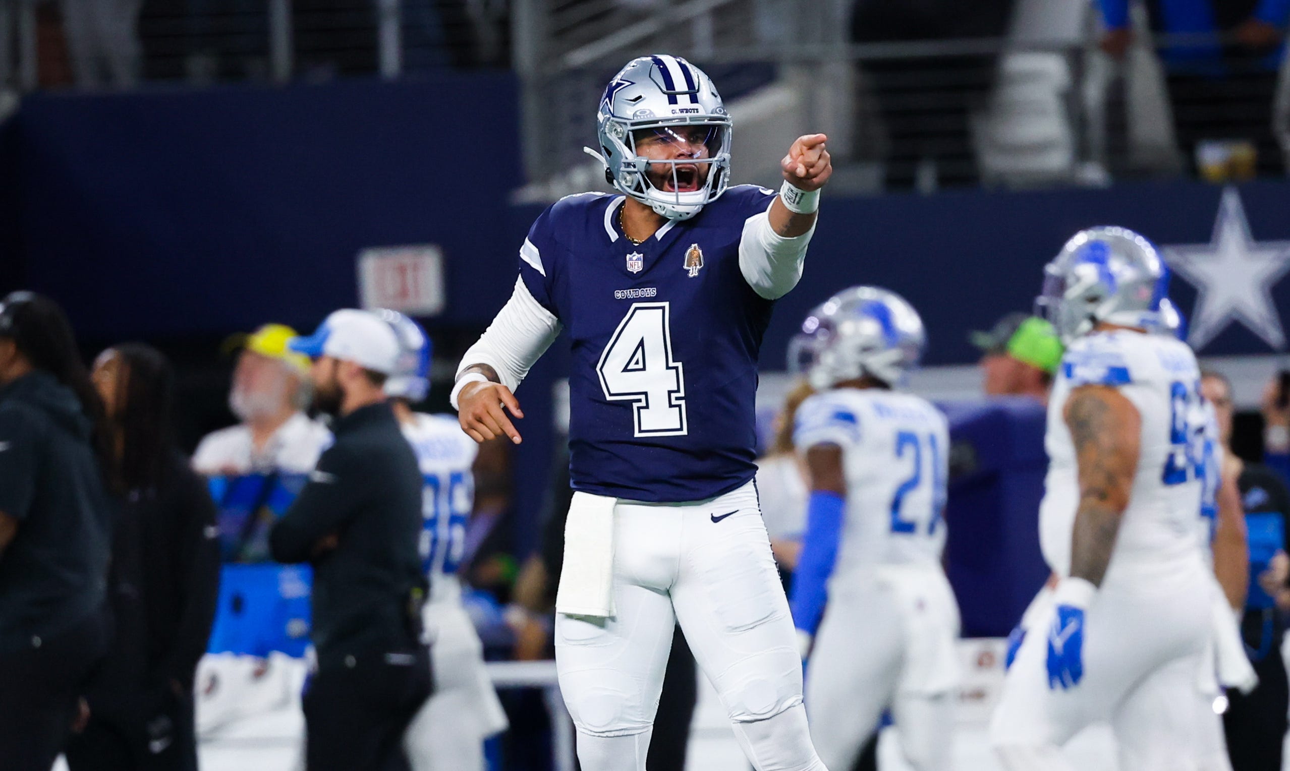 Dec 30, 2023; Arlington, Texas, USA; Dallas Cowboys quarterback Dak Prescott (4) reacts after throwing a touchdown pass during the first half against the Detroit Lions at AT&T Stadium. Mandatory Credit: Kevin Jairaj-USA TODAY Sports