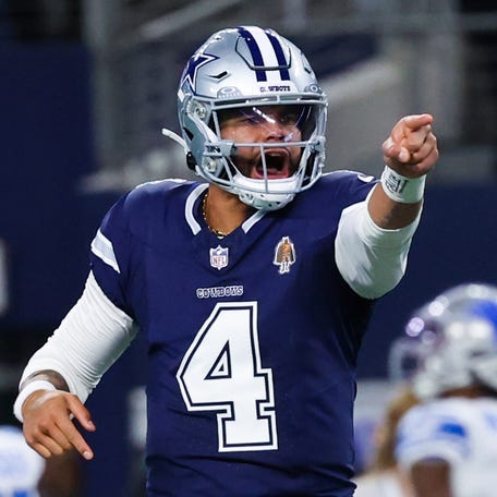 Dec 30, 2023; Arlington, Texas, USA; Dallas Cowboys quarterback Dak Prescott (4) reacts after throwing a touchdown pass during the first half against the Detroit Lions at AT&T Stadium. Mandatory Credit: Kevin Jairaj-USA TODAY Sports