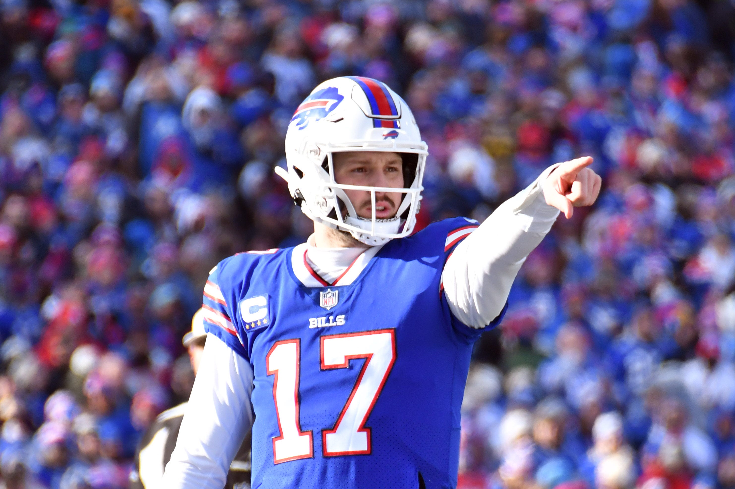 Buffalo Bills quarterback Josh Allen (17) before a snap against the Miami Dolphins during the first half in a NFL wild card game at Highmark Stadium.