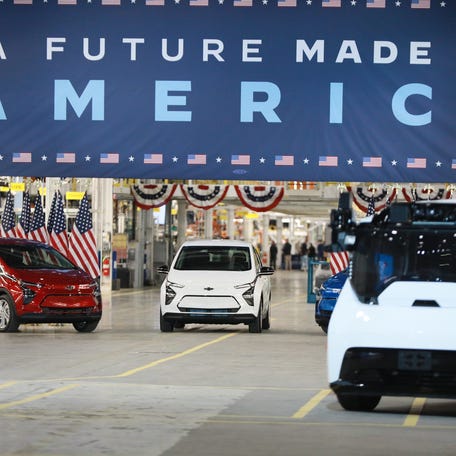 Chevrolet Bolt EV sits on display before U.S. President Joe Biden speaks at the grand opening of General Motor Co.'s Detroit-Hamtramck EV Factory Zero on Wednesday, Nov. 17, 2021. The president added $7.5 billion to create new electric vehicle charging stations as part of his infrastructure package recently passed by Congress and signed into law in November 2021.