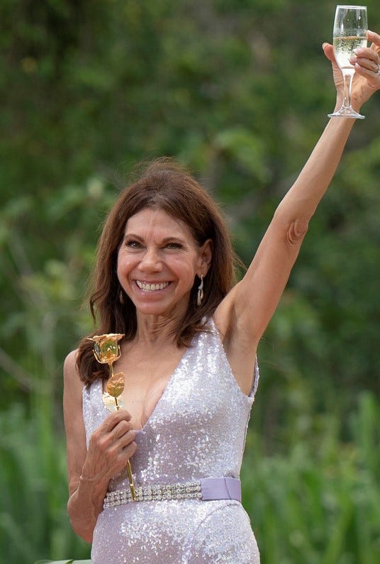 This image released by ABC shows Gerry Turner, left, and Theresa Nist in a scene from the romance competition series "The Golden Bachelor." (John Fleenor/ABC via AP) ORG XMIT: NYET875