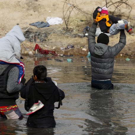 January 2, 2024: Migrants cross the Rio Bravo river, known as Rio Grande in the United States, into the US through Ciudad Juarez, Chihuahua State, Mexico. US border police have in recent weeks reported approximately 10,000 crossings by migrants every day, many of them fleeing poverty and violence in Central America.