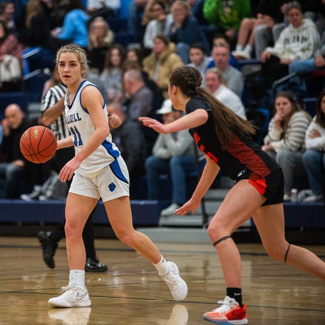Wallkill's Zoe Mesuch, center, eyes a Marlboro defender during the Section 9 girls basketball game at Wallkill High School in Wallkill, NY on Thursday, January 4, 2024. Mesuch scored her 1206 point of her career as the Panthers defeated the Dukes 62-51. KELLY MARSH/FOR THE TIMES HERALD-RECORD