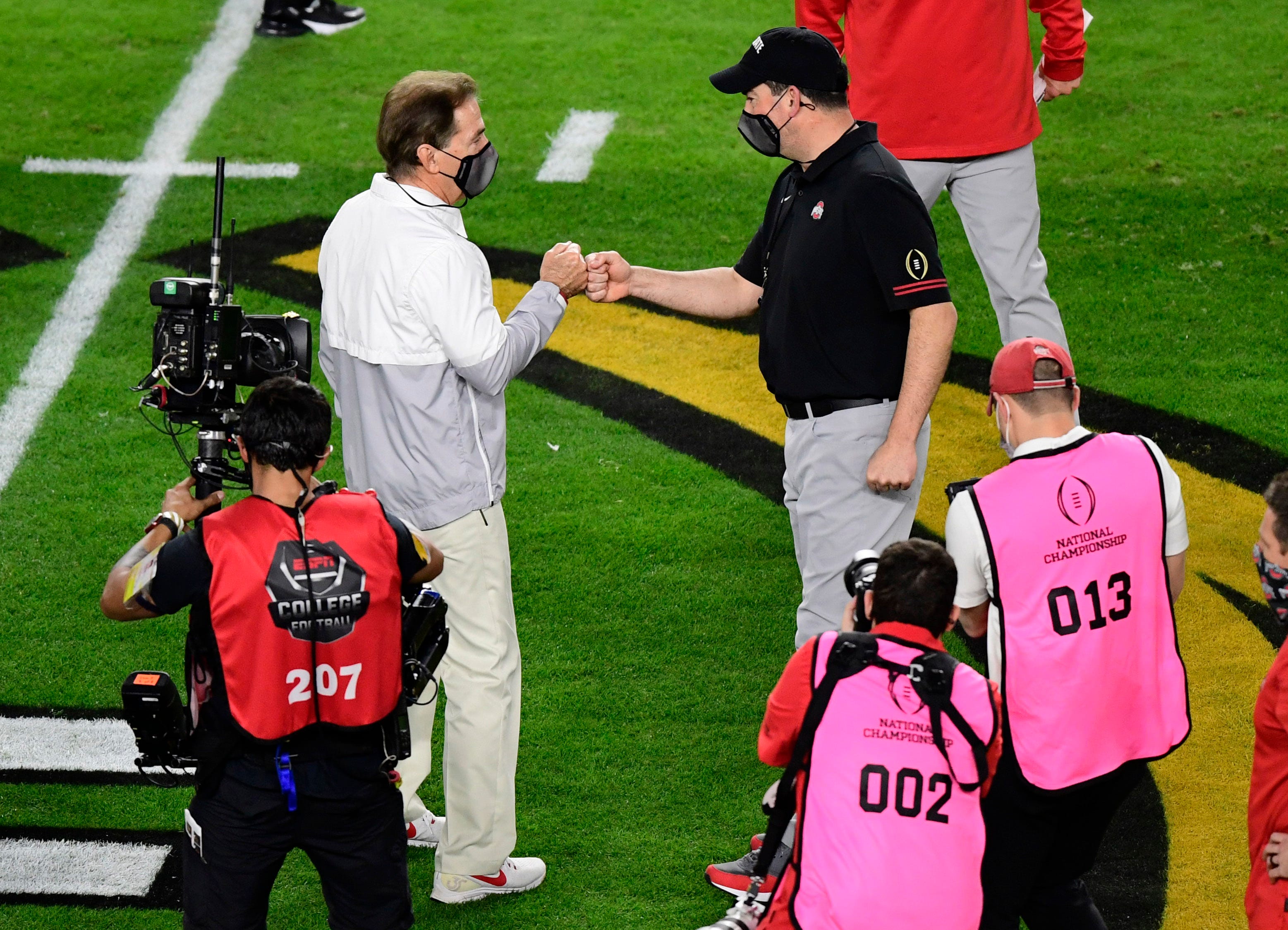 Jan 11, 2021; Miami Gardens, FL, USA; Alabama Crimson Tide head coach Nick Saban (left) greets Ohio State Buckeyes head coach Ryan Day before the 2021 College Football Playoff National Championship Game at Hard Rock Stadium. Mandatory Credit: Douglas DeFelice-USA TODAY Sports