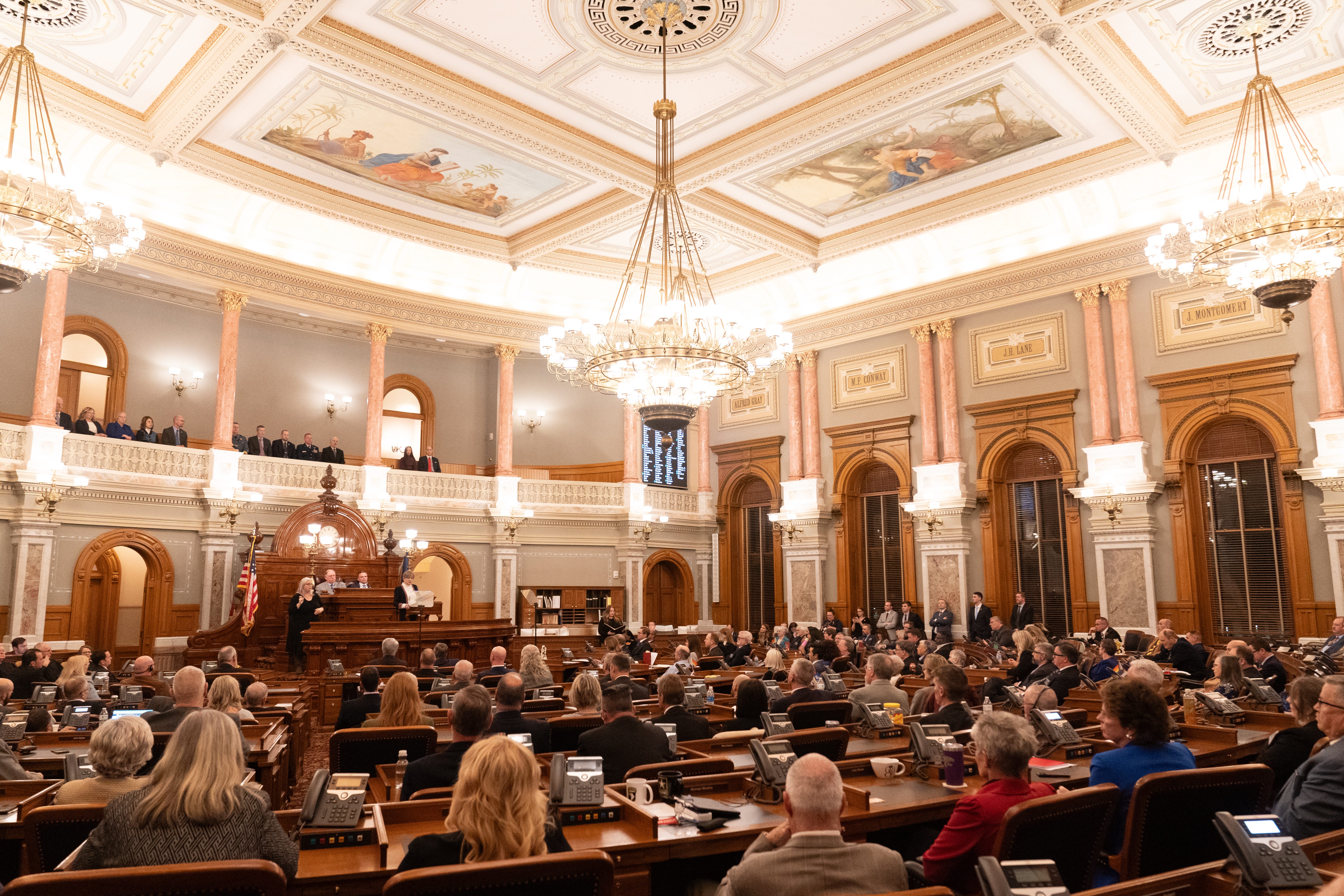 Members of the Kansas Legislature fill in to the House Chambers Wednesday to listen to Gov. Laura Kelly give her State of the State address.