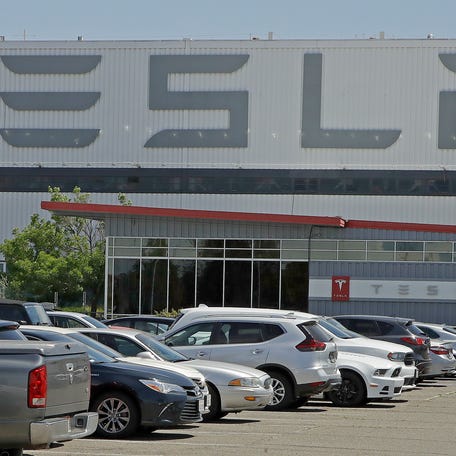 Factory workers at Tesla have been told to expect pay raises in 2024, a move that comes as the United Auto Workers union tries to organize the electric vehicle maker's U.S. plants. (AP Photo/Ben Margot, File)