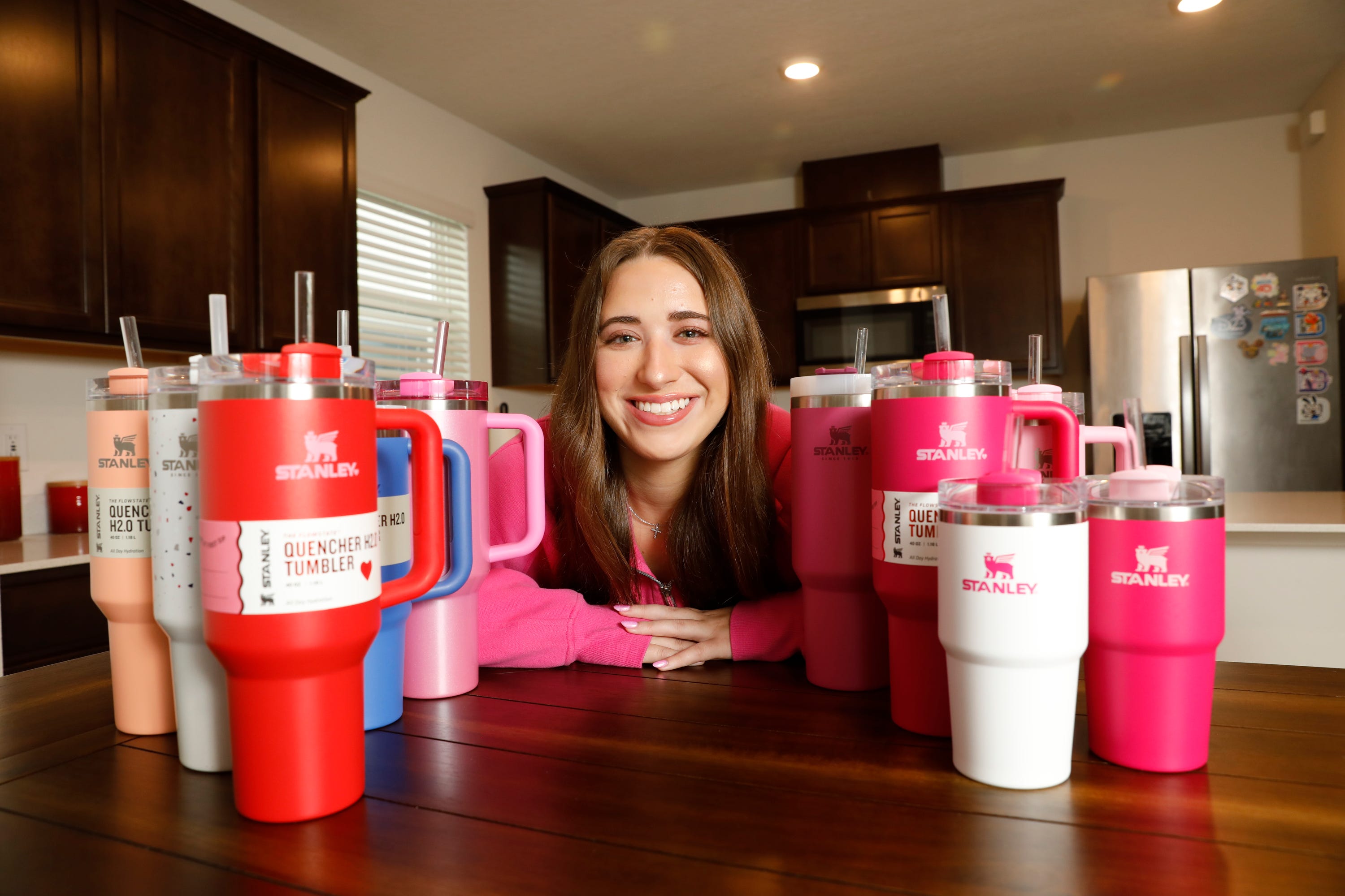 Bella Boye of Tampa, Fla. is photographed with her Stanley cups for a story on the craze around the insulated item.