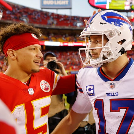 Patrick Mahomes #15 of the Kansas City Chiefs shakes hands with Josh Allen #17 of the Buffalo Bills after the game at Arrowhead Stadium on October 16, 2022 in Kansas City, Missouri.
