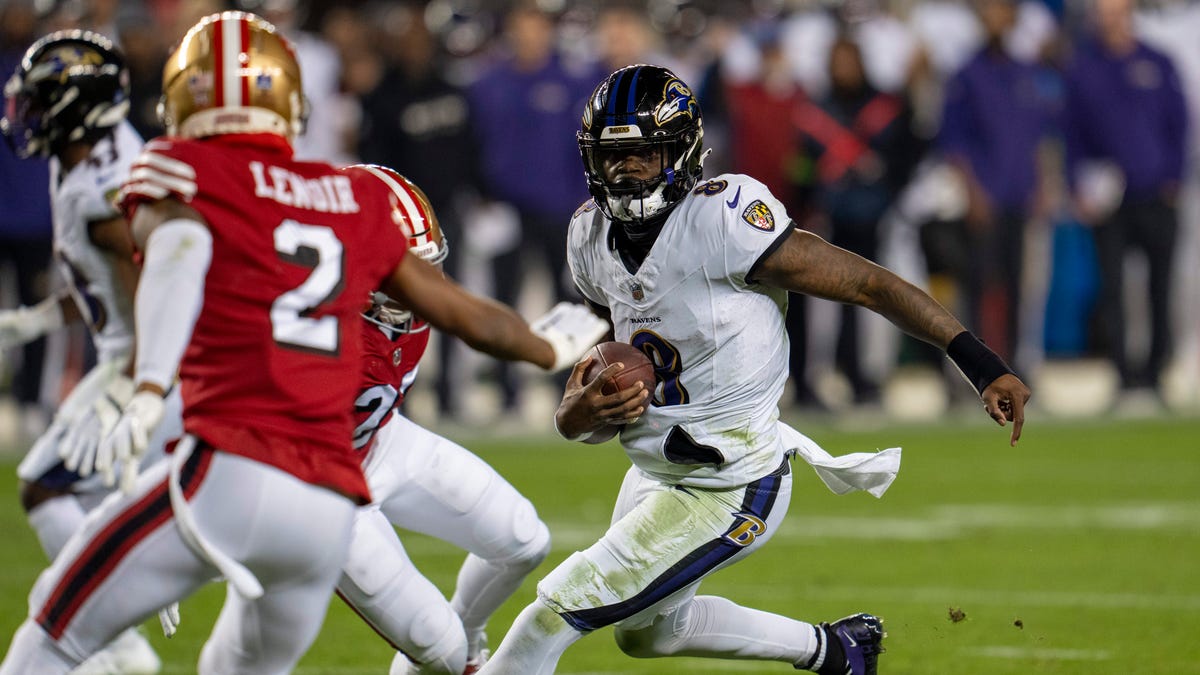 Ravens quarterback Lamar Jackson (8) scrambles against the 49ers during the second quarter of their game at Levi's Stadium in Santa Clara, Calif., on Dec. 25, 2023.