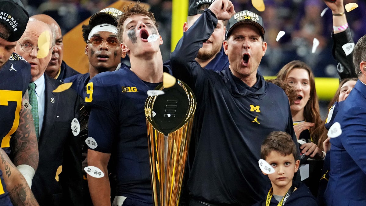 Jan. 8, 2024: Michigan quarterback J.J. McCarthy and head coach Jim Harbaugh celebrate after defeating Washington in the 2024 College Football Playoff national championship game at NRG Stadium.