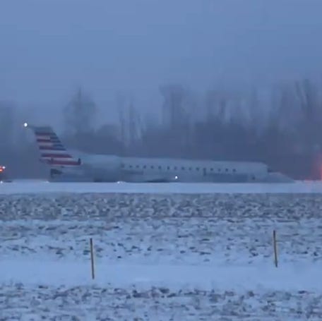An American Airlines airplane skidded off an icy runway while landing at Rochester International Airport Thursday, coming to a stop in snowy grass just off the roadway.