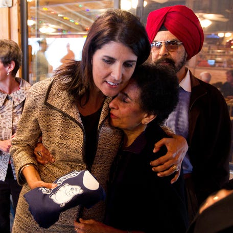 LEXINGTON, SC - NOVEMBER 3: South Carolina Governor-elect Nikki Haley shares a hug with her mom Raj Randhawa after speaking to voters at Hudson's Smokehouse on November 3, 2010 in Lexington, South Carolina. The election of Haley makes her the first Indian-THUAN ORG XMIT: 105699687 [Via MerlinFTP Drop]
