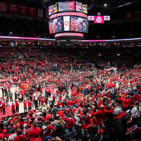 Jan 21, 2024; Columbus, Ohio, USA; Fans storm the court as the Ohio State Buckeyes celebrate following their 100-92 win over the Iowa Hawkeyes in the NCAA womenâ€™s basketball game at Value City Arena.